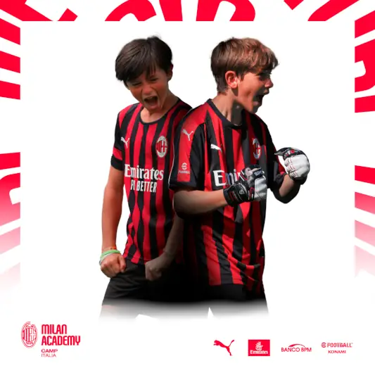 Boys celebrate and have fun after scoring a goal during the AC Milan soccer camps