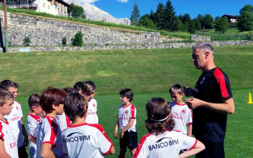 Coach Diego Bortoluzzi provides instructions to young players of the AC Milan Academy Junior Camp