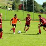 Children play football during the AC Milan Academy Camp