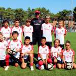 Diego Bortoluzzi with the children of the AC Milan Academy Camp at the playing field of the tourist village in Lignano Sabbiadoro