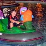 The kids of the AC Milan summer camp in the evening have fun at the Luna Park in Lignano Sabbiadoro