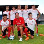 The coach Pierino Prati with seven youth of the AC Milan Academy Junior Camp at the Jesolo stadium (Venice)