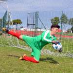 Goalkeeper save in the AC Milan Junior Camp at the Jesolo Stadium (Venice)
