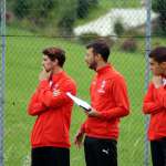 Three coaches of the Sporteventi training staff examine the training sessions in the Milan Academy Camp
