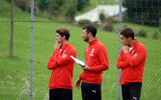 Three coaches of the Sporteventi training staff examine the training sessions in the Milan Academy Camp
