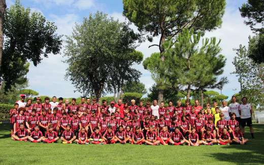 Boys and girls of the AC Milan Junior Camp on the soccer field of Lignano Sabbiadoro (Venice area - Italy)
