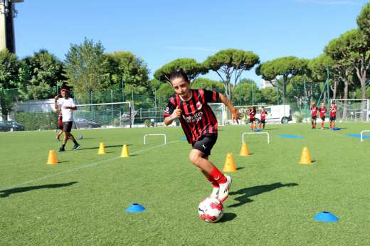 Girl training soccer at the Milan Academy Camp