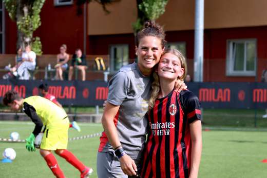 Girl with her soccer coach at the AC Milan Camp Woman