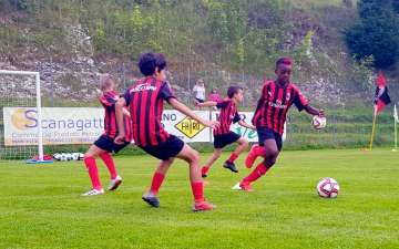 Young players (three against two) during tactical training at AC Milan summer football camps