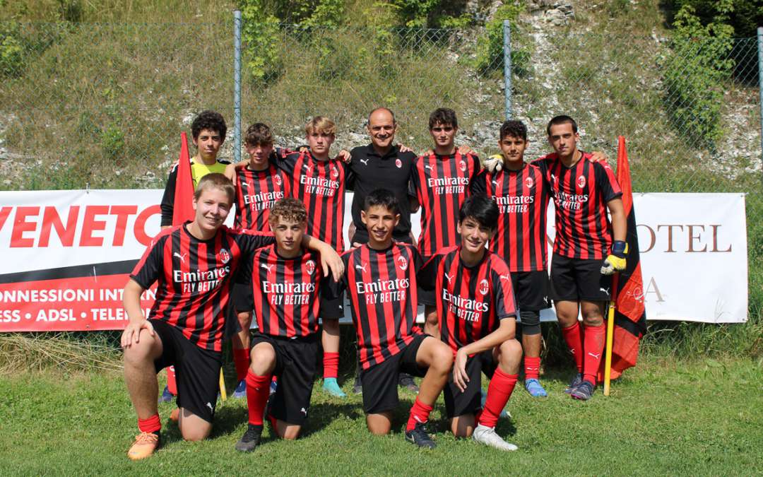 AC Milan Junior Camp youth footballer team with Walter De Vecchi at the soccer field in Asiago Plateau